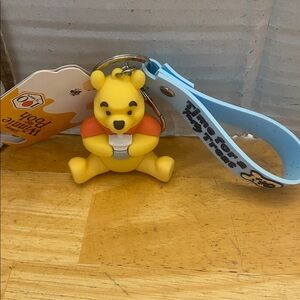 Disney Winnie the Pooh Yellow Silicone 3d bag charm Keychain w Light Blue Strap